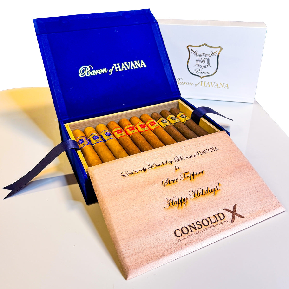 A Baron Classic box with Blue, Red and Black Baron cigars and an engraved holiday lid