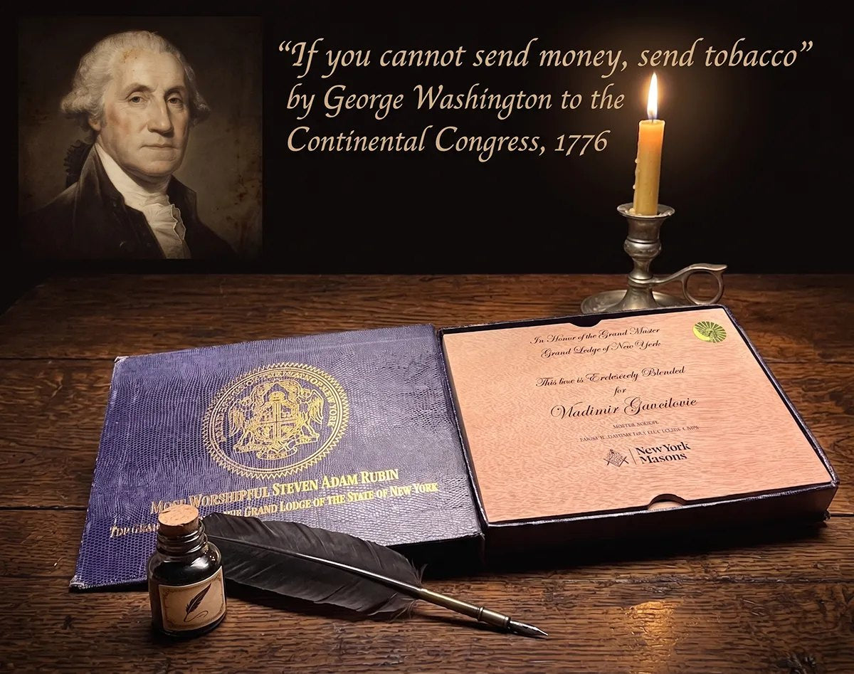 A Grand Master box honoring nearly two and a half centuries of New York Freemasonry: blue velvet, the Grand Lodge crest, and a cedar lid engraved for the Grand Master, beneath a portrait of George Washington.