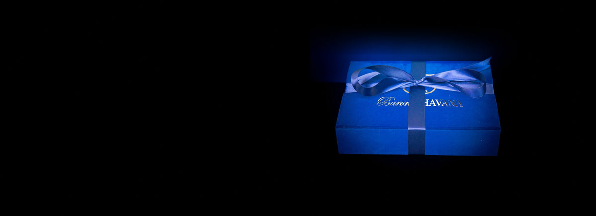 A Baron of HAVANA gift box wrapped with a ribbon