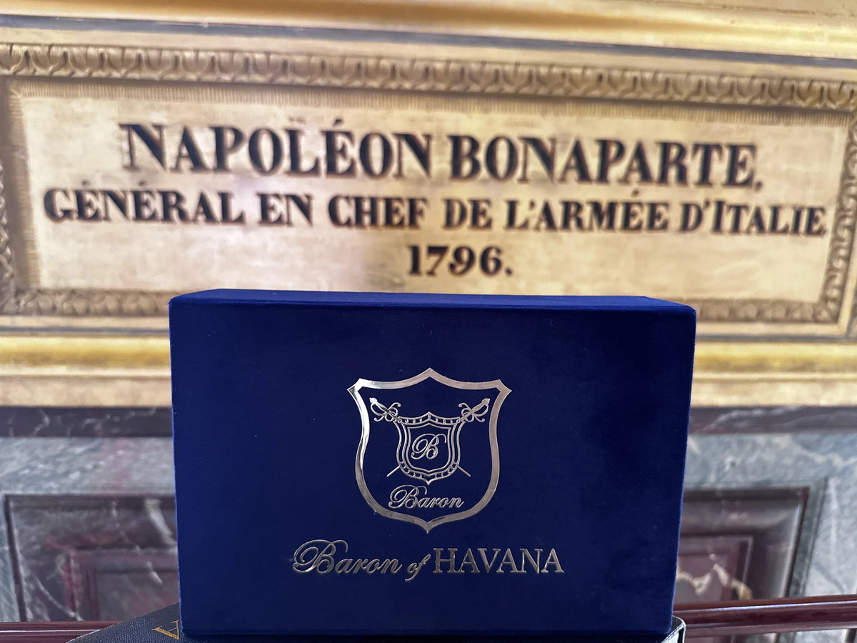A Baron of HAVANA velvet box beneath a gilded plaque honoring Napoleon Bonaparte